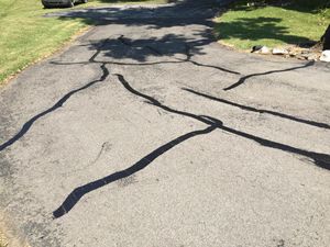 Our Patching service efficiently repairs damaged asphalt by filling cracks and potholes, ensuring a smooth, durable surface that enhances safety and extends the lifespan of your driveway or pavement. for Specialty Paving and Sealcoating in Gallatin, TN
