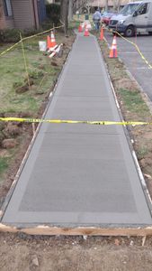 Our Concrete Work service offers professional and reliable solutions for homeowners looking to enhance their outdoor spaces with durable and visually appealing concrete structures such as driveways, patios, and walkways. for PM Masonry in Manville, NJ