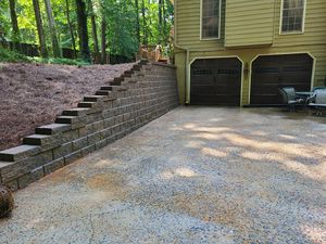 Our retaining wall installation service offers homeowners the expertise and experience to construct durable and aesthetically pleasing retaining walls as part of their landscaping or hardscaping projects. for Fusion Contracting in North Georgia, GA