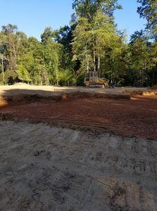 Enhance your property's foundation with our expert land grading services, ensuring optimal drainage and a level surface for future construction projects, while enhancing landscape aesthetics and reducing potential water damage. for Fisher Hauling And Grading in Rockingham County, NC