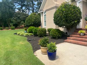 Our comprehensive landscaping service transforms your outdoor space into a beautiful and well-maintained haven, offering a range of services including Mulch, Rock, Pine Straw, Plant installation and more. for Four Seasons Property Care in Aiken, SC