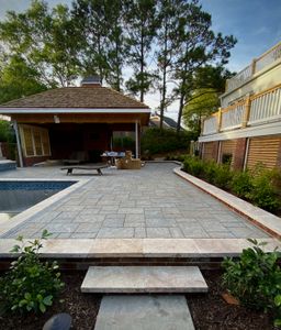 Our Outdoor Kitchens service offers homeowners the opportunity to enhance their outdoor living space with custom-designed kitchens, creating the perfect area for entertaining and cooking in nature. for Djosey Landscapes in Wilmington, NC