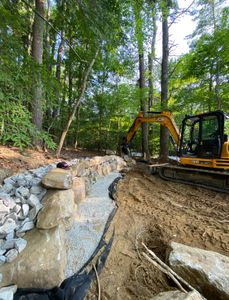 Enhance your outdoor space with our expert retaining wall construction services, providing durability and aesthetic appeal while preventing soil erosion and creating beautiful, functional landscapes tailored to your home's unique needs. for BRB Property Management in Moultonborough, NH