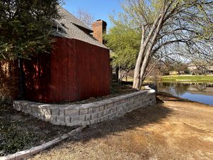 Our Retaining Walls service offers secure and aesthetically pleasing solutions for stabilizing slopes, creating additional usable space, and enhancing the overall look of your backyard. for Conoly Contracting & Outdoor Living LLC in Caddo Mills, Texas