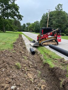Our Ditch Enclosure and Drainage service enhances your landscape by efficiently managing water flow, reducing erosion, and improving aesthetics while protecting your property from potential water damage. for Kunkle & Sons Property Maintenance in Akron, OH