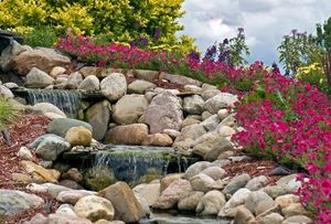 Our Natural Stone Hardscape service offers homeowners a durable and aesthetically pleasing solution for enhancing outdoor spaces with the timeless beauty of natural stone materials. for Dove Springs Landscaping Services in Austin, Texas