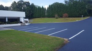 Our Asphalt Striping service provides precise and professional painting of lines, pavement markings, and parking lot striping for enhanced safety and organization on your property. for Johnson's Sealcoating & Painting in Inman, SC