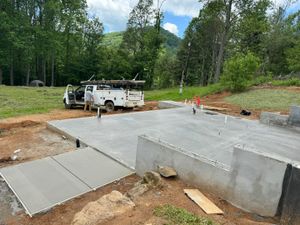 Our Septic System Installation service ensures reliable and efficient waste management solutions, complementing our expert sidewalk installation services to enhance your property's functionality and curb appeal with durable concrete work. for Bass Concrete LLC in Weaverville, NC