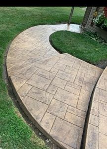 Enhance your home's aesthetic appeal with our expert concrete coloring and dye services. Our professional team transforms ordinary surfaces into vibrant masterpieces, adding value and beauty to your property through exceptional concrete services. for Custom Concrete Enterprises in Springfield, IL