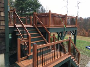 Enhance your outdoor space with our expert deck installation service. Our skilled carpenters design and build beautiful, durable decks to perfectly complement your home, ensuring quality craftsmanship and lasting enjoyment. for Sanchez Construction NH in Dover, New Hampshire