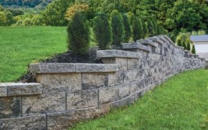 Our Retaining Wall service provides expert installation of sturdy and visually appealing walls that help prevent soil erosion, create beautiful terraced gardens, and add functionality to your outdoor space. for E&T Outdoor Pros in LaGrange, GA