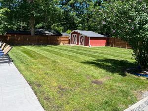 Our Lawn Aeration service helps improve the health and appearance of your lawn by creating small holes that allow air, water, and nutrients to reach the roots more easily. for Three Brothers Lawn & Landscaping LLC in Yorktown, VA