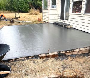 Our Concrete service offers professional and reliable solutions for all your concrete needs, whether it's repairing a cracked driveway or installing a new patio. for Racketty Boom Construction  in Centralia, WA