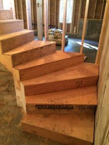 Enhance your home's elegance with our expert wood stairs service, offering custom designs and precise craftsmanship to ensure durable, beautiful results that perfectly match your style and architectural needs. for Sanchez Construction NH in Dover, New Hampshire