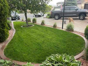 Our Lawn Maintenance service ensures a lush, healthy lawn with regular mowing, fertilization, and weed control. Enjoy a pristine outdoor space effortlessly year-round with our expert care for your home. for Escala Concrete & Landscaping in Colorado Springs, CO