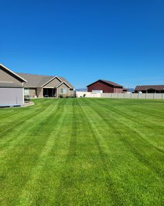 Our professional mowing service ensures a well-maintained and beautifully manicured lawn, giving your home's landscape the perfect finishing touch. for Yeti Snow and Lawn Services in Helena, Montana