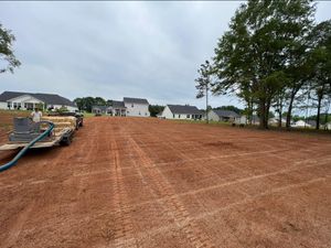 Our expert team provides precise land grading services to ensure proper drainage and a level foundation for your landscaping projects, guaranteeing a visually appealing and functional outdoor space. for Elite Landscaping LLC in Anderson, SC