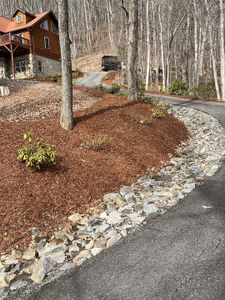 Our Mulch Installation service is a great way to add curb appeal to your home. We can install mulch in your flower beds, around trees, and even in your driveway! Mulch insulates plant roots, maintains moisture, and provides weed control. Contact us today for your custom price quote. for HG Landscape Plus in Asheville, NC