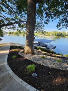 Our Mulch Installation service is a great way to add color and texture to your landscape. We can install mulch in beds, around trees, and even in containers. for Viking Dirtworks and Landscaping in Gallatin, MO
