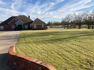 Our Lawn Care service ensures that your lawn stays neat, healthy, and vibrant throughout the year so you can enjoy a beautiful outdoor space. for Winding Creek Construction & Landscaping in Mcloud, OK