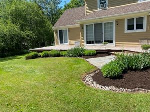 Our Mulch Installation service is a quick and easy way to improve the look of your yard. We will deliver mulch to your home and install it for you, so you can enjoy the new look of your yard in no time! for Mullet Man Property Services in Cazenovia, New York