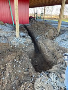 Our trenching service provides precise and efficient excavation for utility installations or drainage systems in your landscaping project. Trust our expert team to ensure safety and accuracy while enhancing your home's functionality. for New Horizon Contracting in Bardstown, KY