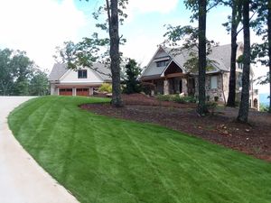 Mulch is used to help maintain the health of your landscape and adds a professional touch to any planter. It can be placed over soil to lock in moisture and improve soil conditions to encourage a healthier lawn. We provide a variety of professional mulching services. for Georgia Pro Scapes in Cumming, Georgia