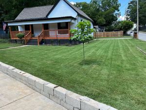 Our Lawn Mowing and Maintenance service ensures a pristine, well-manicured lawn with regular mowing, edging, and care tailored to your landscape's unique needs for enhanced curb appeal all year round. for Drake Lawn Care in Atlanta, GA