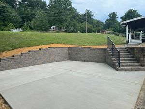 Our expert retaining wall service ensures stability and aesthetic enhancement for your property, providing durable concrete solutions tailored to prevent soil erosion and manage sloped landscapes effectively for a safer home environment. for Berks Concrete & Construction LLC in Berks County, PA