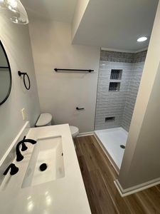 Our Bathroom Renovation service offers homeowners a complete makeover for their bathrooms, enhancing the space with modern fixtures and designs to create a sophisticated and functional retreat. for Top Tier Construction in Madison Heights, VA