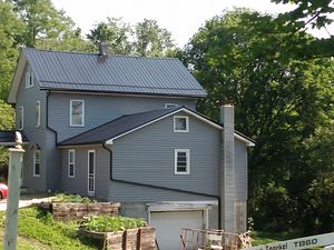 Our Roofing Replacement service offers homeowners a hassle-free and professional solution to replace their damaged or aging roof, ensuring long-term protection for their home. for Dave's Seamless Gutters & Contracting in Northern Cambria, Pennsylvania