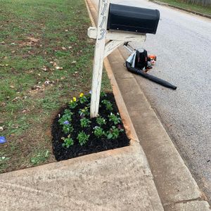 Our Flower Bed Installation service includes mulch delivery and installation to enhance your landscape with beautiful blooms and vibrant colors, creating a stunning focal point in your yard. for Sanders Landscape & Maintenance in McDonough, GA