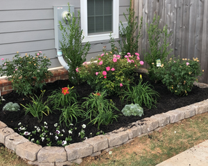 Small Landscape Design/ Install.  Flowerbed with a simple and clean design with mulch and edging. Pricing: $800-$2,000 for Ozark Lawn Professionals LLC in Lowell, AR