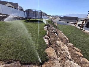 Enhance your lawn's health with our professional aeration service. We can install a full sprinkler system according to your needs as well as drip lines for your garden areas. for Logan River Landscaping in Logan, UT