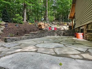 Our Retaining Wall Construction service enhances your landscape's stability and aesthetics, offering expertly built structures to prevent soil erosion while providing a durable, visually appealing addition to your outdoor space. for Vandermeer Stone and Excavation in Wayne County, PA