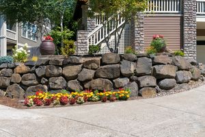 Our Retaining Wall Construction service is perfect for homeowners looking to improve the overall look and functionality of their property. We can build custom retaining walls that will not only add value to your home, but also make your outdoor living space more enjoyable. for Eddie’s Lawn Care in Chesapeake, VA