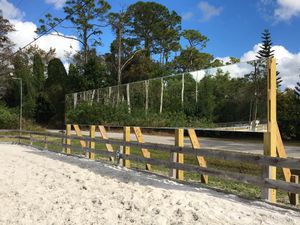 Our Wooden or Concrete Mirror Wall service offers a unique way to enhance your home's landscaping. Our mirror walls are made of high-quality wood or concrete and can be customized to match your home's style. for Florida Native Equestrian Services in Polk, FL