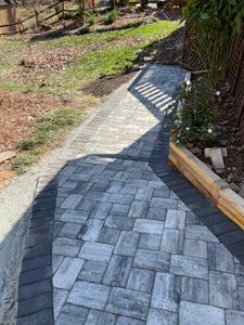 Our Paver walkways service offers homeowners a durable and aesthetically pleasing solution for creating beautiful pathways in their outdoor spaces. for DLS Landscaping in Charlotte, NC