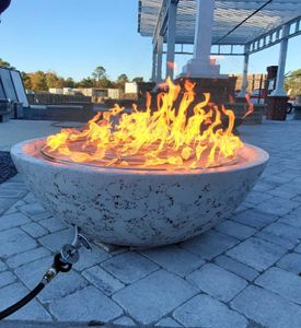 We offer professional Fire Pit Installation services to help homeowners enhance their outdoor living spaces with a safe and stylish addition, providing warmth and creating an inviting atmosphere for gatherings. for Bianchi Construction Company Inc in Southport, NC