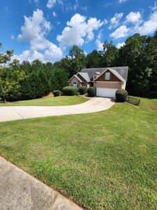 Our Bush Hogging service efficiently clears overgrown brush and vegetation from your property, creating a clean and well-maintained outdoor space that enhances the aesthetics of your home. for Deeply Rooted Lawn Maintenance in Winder, GA
