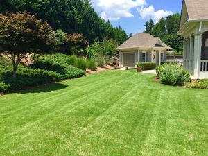 Our professional mowing service offers homeowners a hassle-free solution for maintaining their lawn, ensuring a well-manicured and pristine outdoor space. for Vivid Color Landscapes, LLC in Woodstock, GA