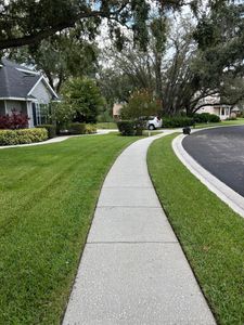 Our mowing service provides a neat and tidy lawn by cutting grass to the desired height and trimming around trees, fences, and other landscaping features. for Estrada All Pro Lawn Service in Auburndale, Florida