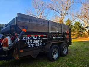 Enhance your home's curb appeal effortlessly with our Dump Trailer Services. Efficiently remove debris, ensuring a clean environment for Zepeda's Mowing in Fort Valley, GA