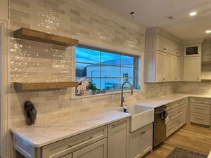 Our Kitchen Remodeling service provides homeowners with expert craftsmanship and innovative designs, transforming their kitchen into a stunning space that meets their functional needs and aesthetic preferences. for Ferrer's Interiors in Centerton, AR