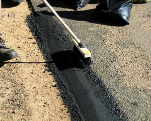 Our Asphalt seal coating and repairs service protects your driveway from weather damage, extends its lifespan, and enhances curb appeal with a durable finish, ensuring long-lasting value for your home. for Bruce's Removal Demolition and Tree Services in Gilsum, NH