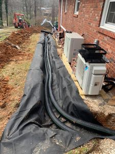 We offer French Drains to redirect excess water away from your home, preventing flooding and erosion. for Elias Grading and Hauling in Black Mountain, NC