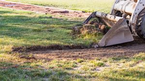 Our Land Grading service levels and grades your yard to provide a smooth, even surface for installation of sod, plants, or hardscape features. We clear the area of debris and grade the soil to provide a stable foundation for your landscaping. for Dunn-Rite Landscaping in New Oxford, PA