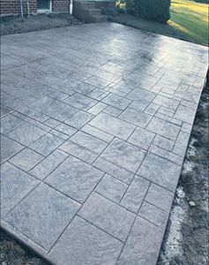 Our Stamped Concrete Installation service offers homeowners the opportunity to enhance their outdoor spaces with custom-designed and long-lasting concrete surfaces featuring a variety of patterns and colors. for Doncrete LLC in Medina, OH