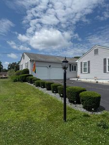 Enhance your home's curb appeal with our expert Shrub Trimming service, ensuring healthy growth and beautifully shaped shrubs through precise cuts and attentive care tailored to each plant's unique needs. for Navedo’s Lawn Care in Putnam, CT