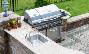 Transform your backyard with our Outdoor Kitchens service, offering custom designs and installations to create a functional and stylish cooking area perfect for entertaining family and friends. for King Kutz Landscaping in Apopka, FL